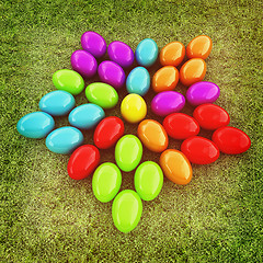 Image showing Colored Easter eggs as a flower on a green grass. 3D illustratio