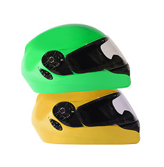 Image showing Orange and green bike helmets