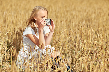 Image showing woman taking picture with camera in cereal field