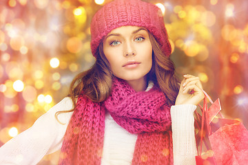 Image showing happy woman in winter clothes with shopping bags