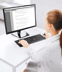 Image showing businesswoman with coding on computer at office