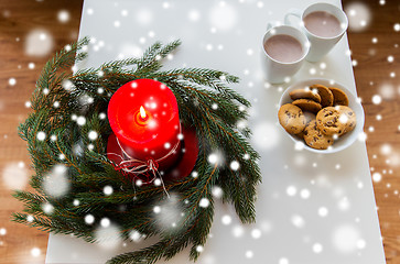 Image showing close up of christmas wreath with candle on table