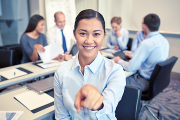 Image showing group of smiling businesspeople meeting in office