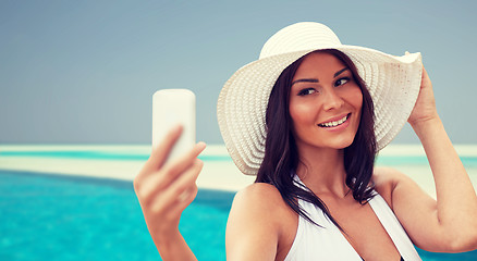 Image showing young woman taking selfie with smartphone