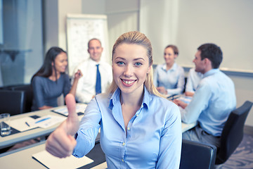 Image showing group of smiling businesspeople meeting in office