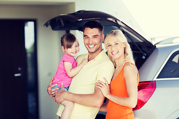 Image showing happy family with hatchback car at home parking