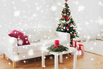 Image showing sofa, table and christmas tree with gifts at home