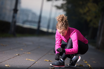 Image showing woman  stretching before morning jogging