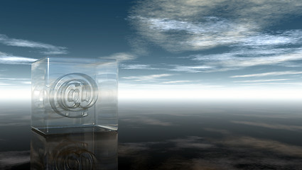 Image showing email symbol in glass cube under cloudy sky - 3d rendering