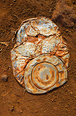 Image showing Old crushed rusty tin can