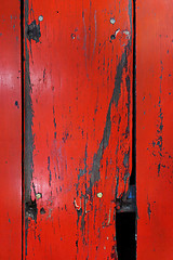 Image showing Old wood board painted red