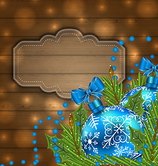 Image showing Wooden label with Christmas balls and fir twigs
