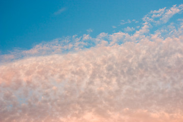 Image showing Yellow and orange clouds on blue sky