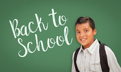 Image showing Hispanic Boy In Front of Back To School Chalk Board