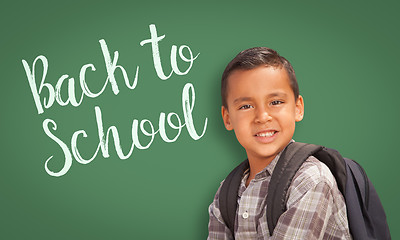 Image showing Hispanic Boy In Front of Back To School Chalk Board