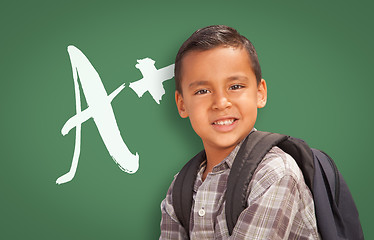 Image showing Hispanic Boy Up in Front of A+ Written on Chalk Board