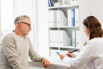 Image showing senior man and doctor meeting at hospital