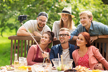 Image showing friends taking selfie at party in summer garden