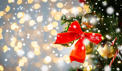 Image showing close up of red bow decoration on christmas tree