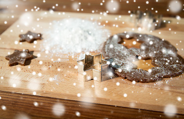 Image showing close up of ginger dough, molds and flour on board