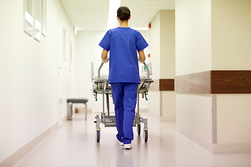 Image showing nurse carrying hospital gurney to emergency room