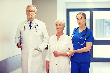 Image showing medics and senior patient woman at hospital