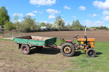 Image showing tractor with trailer in the village