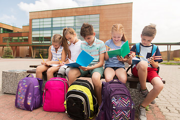 Image showing group of happy elementary school students outdoors