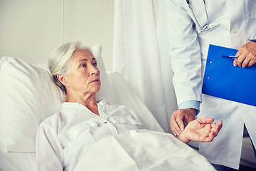 Image showing doctor checking senior woman pulse at hospital