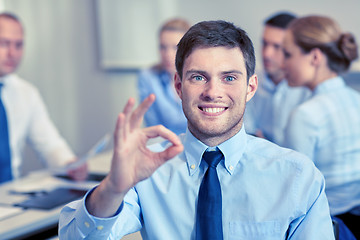 Image showing group of smiling businesspeople meeting in office