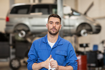 Image showing auto mechanic man or smith at car workshop