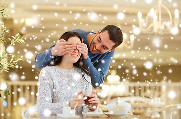 Image showing happy couple drinking tea at cafe