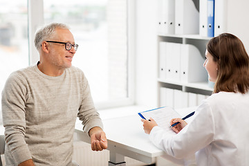 Image showing senior man and doctor meeting at hospital