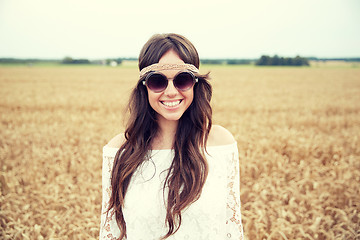 Image showing smiling young hippie woman on cereal field