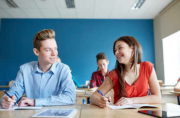Image showing group of happy students talking at school lesson