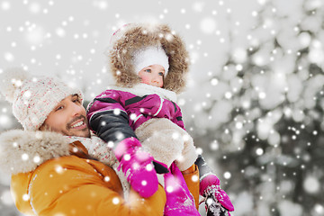 Image showing happy family in winter clothes outdoors