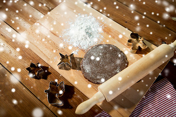 Image showing close up of ginger dough, molds and rolling pin