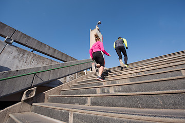 Image showing young  couple jogging on steps