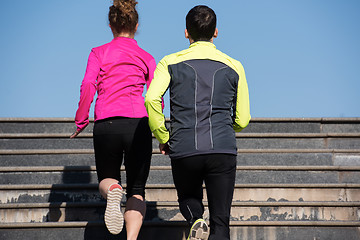 Image showing young  couple jogging on steps