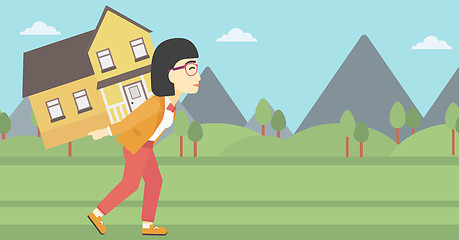 Image showing Woman carrying house vector illustration.