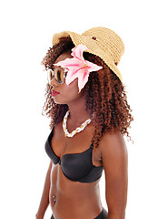 Image showing A black woman in bra and straw hat.