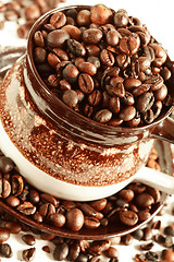 Image showing Cup of coffee beans on white