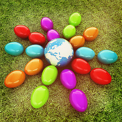 Image showing Colored Easter eggs as a flower on a green grass. 3D illustratio