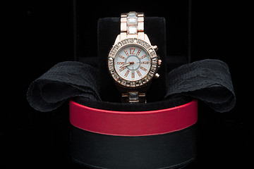 Image showing gold watch isolated on black background