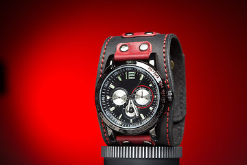 Image showing men\'s watches with wide leather red bracelet 