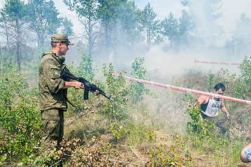 Image showing Soldier shoots by blank cartridges for shock