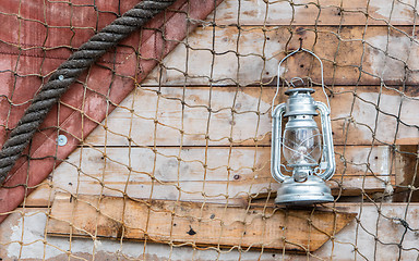 Image showing Old kerosene lamp hanging