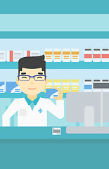 Image showing Pharmacist showing some medicine.