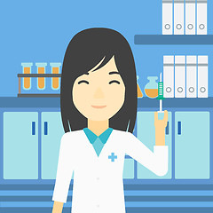 Image showing Laboratory assistant with syringe in lab.