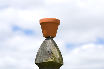 Image showing Flower Pot On Fence Post